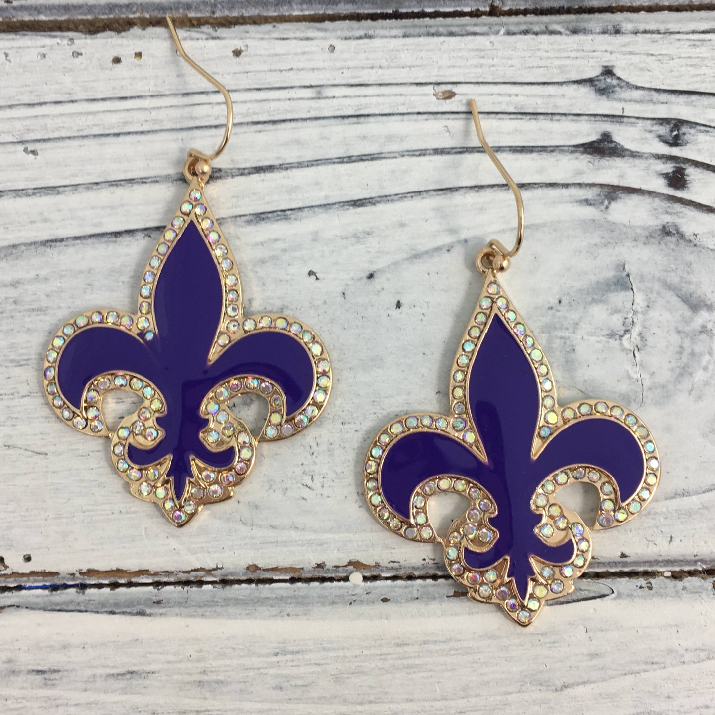 Stone lined fleur de lis earrings PUR